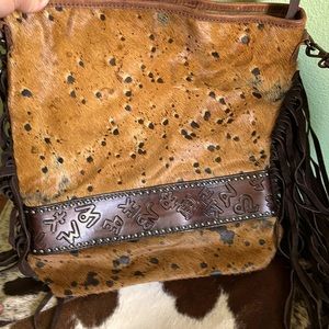 American Darling hair on hide with tooled leather brands design (so cool)